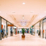 Shops with clothes at the modern shopping mall Shopping Centre. Shops with clothes at the modern shopping mall Shopping Centre