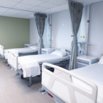 General view of an empty hospital room with three beds. medicine, health and healthcare services. General view of an empty hospital room with three beds. medicine, health and healthcare services.